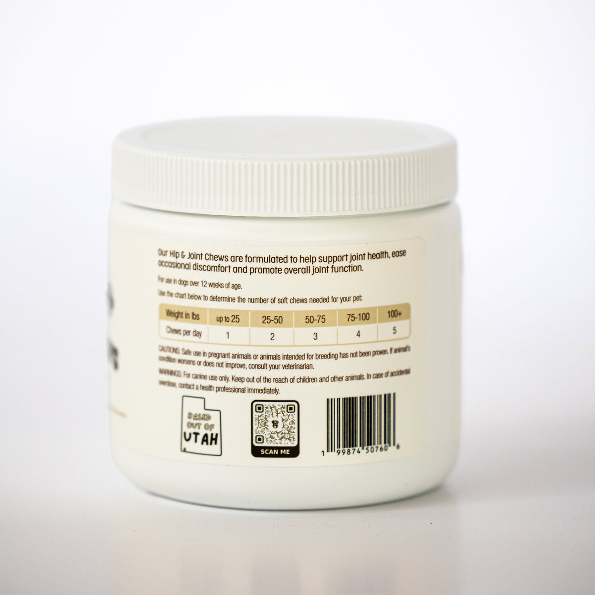 A white plastic jar of Hip & Joint Chews supplement, showing the back label with dosage, a QR code, and a barcode on a white background.